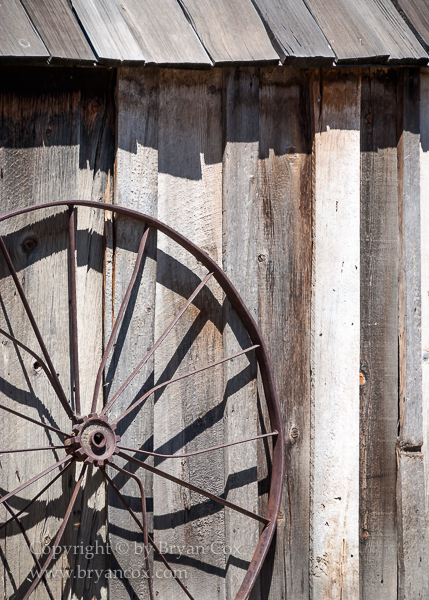 Image of Wagon wheel rim and shed