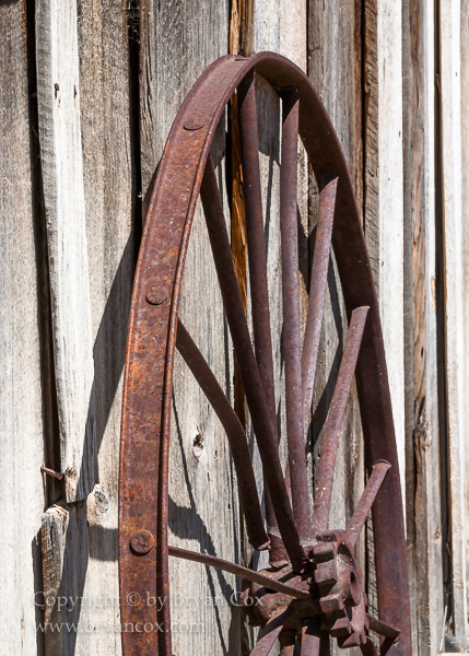 Image of Wagon wheel rim and shed